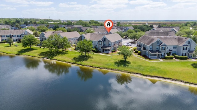 birds eye view of property featuring a water view and a residential view