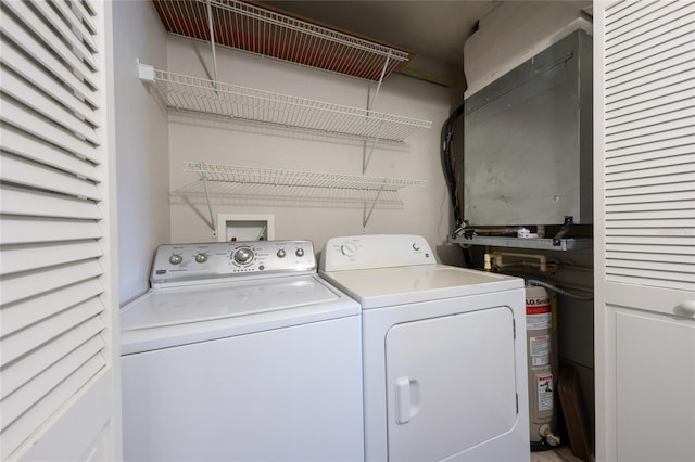 washroom featuring separate washer and dryer and laundry area