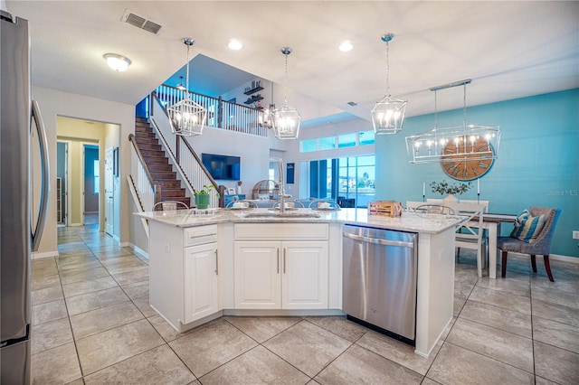 3041 Cardillino Way, Kissimmee, FL 34741 - kitchen with a chandelier, appliances with stainless steel finishes, a sink, and visible vents