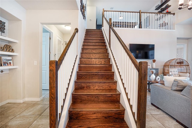 3041 Cardillino Way, Kissimmee, FL 34741 - stairs featuring built in features, baseboards, and tile patterned flooring