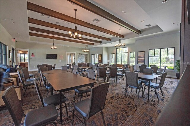 3041 Cardillino Way, Kissimmee, FL 34741 - dining room with visible vents, baseboards, beam ceiling, and an inviting chandelier