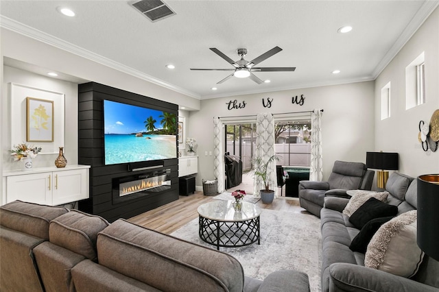 living area featuring ceiling fan, recessed lighting, visible vents, and light wood-style flooring