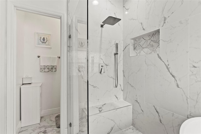 bathroom with marble finish floor and a marble finish shower