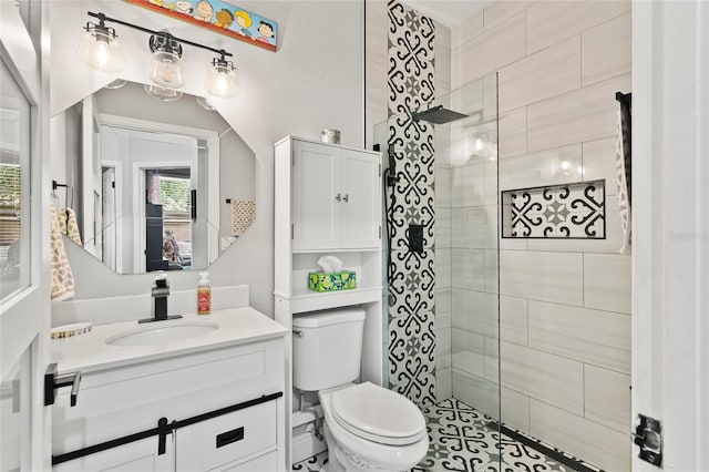 full bathroom with toilet, walk in shower, and vanity