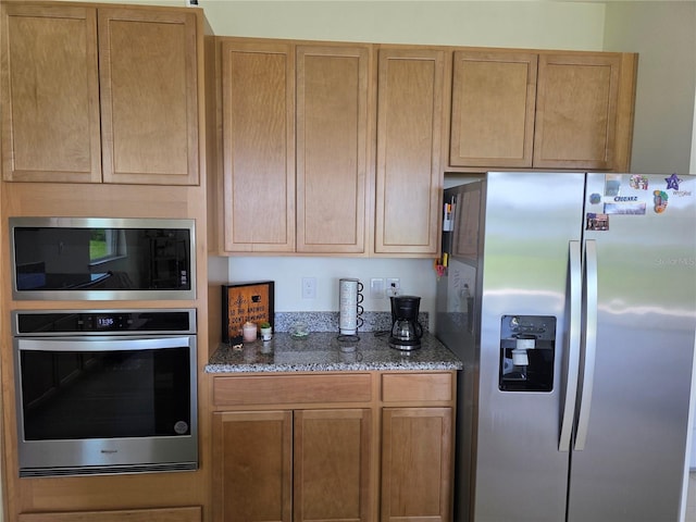 1764 Stamen Dr, Kissimmee, FL 34744 - kitchen with appliances with stainless steel finishes and stone countertops