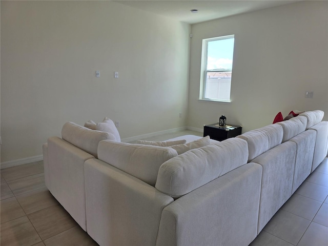 1764 Stamen Dr, Kissimmee, FL 34744 - living room featuring light tile patterned floors and baseboards