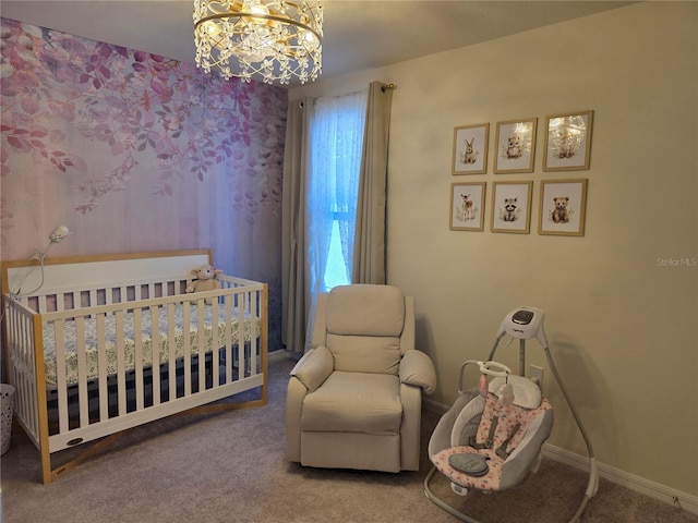 1764 Stamen Dr, Kissimmee, FL 34744 - carpeted bedroom with a notable chandelier, baseboards, and a nursery area