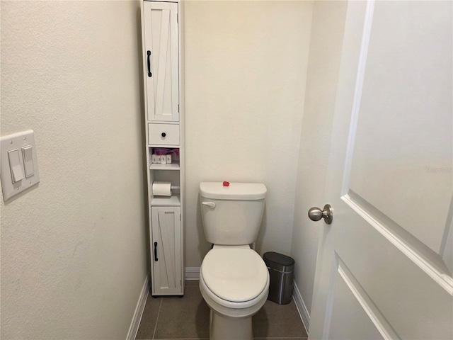 1764 Stamen Dr, Kissimmee, FL 34744 - bathroom with toilet, tile patterned floors, and baseboards