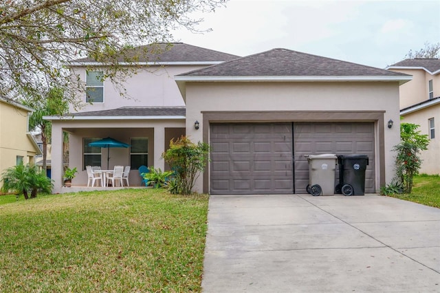 987 Alston Bay Blvd, Apopka, FL 32703 - rear view of property with stucco siding, concrete driveway, a yard, and a garage