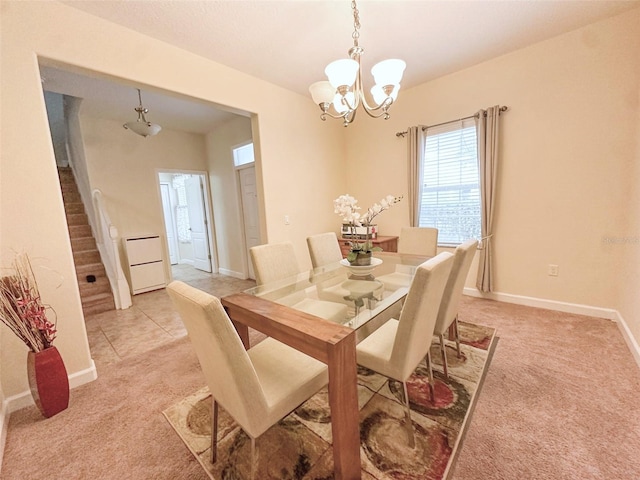 987 Alston Bay Blvd, Apopka, FL 32703 - dining room with light colored carpet, baseboards, a notable chandelier, and stairs