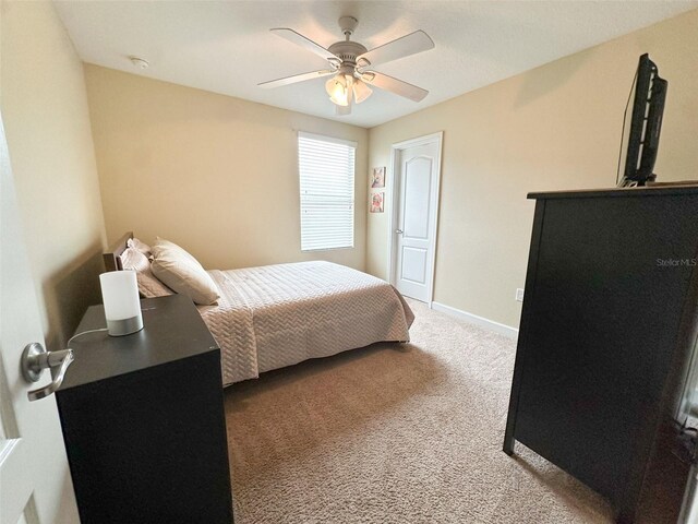 987 Alston Bay Blvd, Apopka, FL 32703 - carpeted bedroom with ceiling fan and baseboards