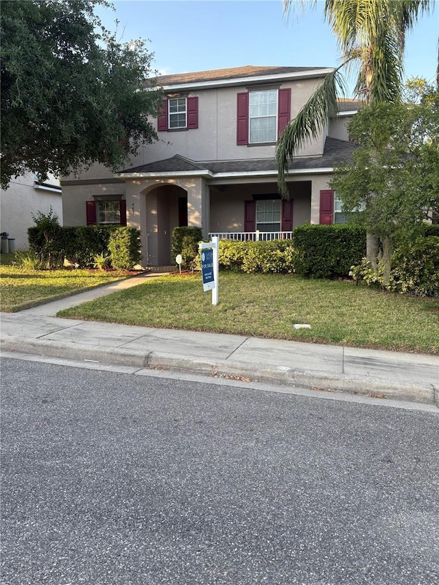 987 Alston Bay Blvd, Apopka, FL 32703 - traditional-style home with a front lawn and stucco siding