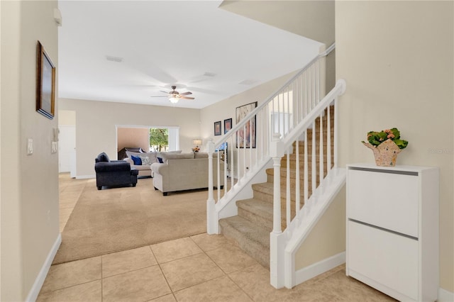 987 Alston Bay Blvd, Apopka, FL 32703 - staircase with carpet, a ceiling fan, and tile patterned flooring