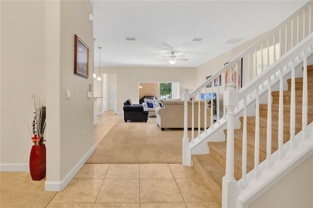 987 Alston Bay Blvd, Apopka, FL 32703 - staircase with carpet, a ceiling fan, and tile patterned flooring