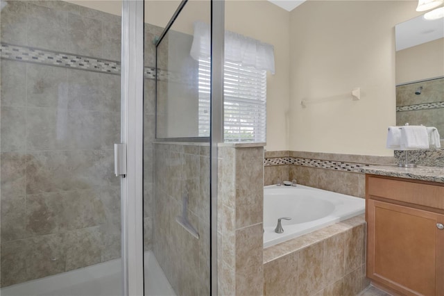 987 Alston Bay Blvd, Apopka, FL 32703 - full bathroom featuring vanity, a shower stall, and a garden tub