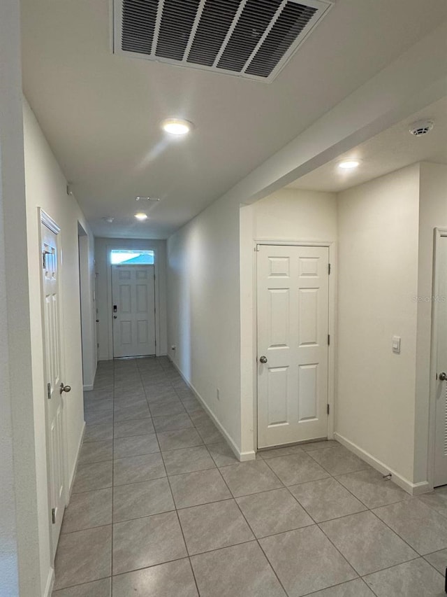 7162 Tigereye Way, Grant, FL 32949 - corridor with light tile patterned flooring and recessed lighting