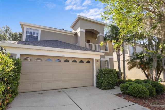 9244 Pecky Cypress Way, Orlando, FL 32836 - mediterranean / spanish home with concrete driveway, a garage, a balcony, and stucco siding
