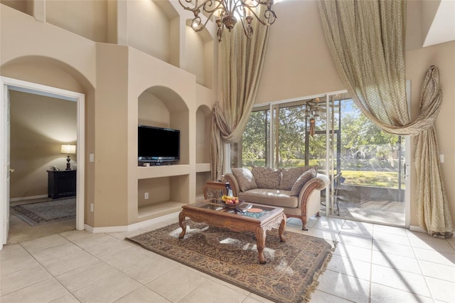 9244 Pecky Cypress Way, Orlando, FL 32836 - living room featuring built in features, tile patterned flooring, and a towering ceiling