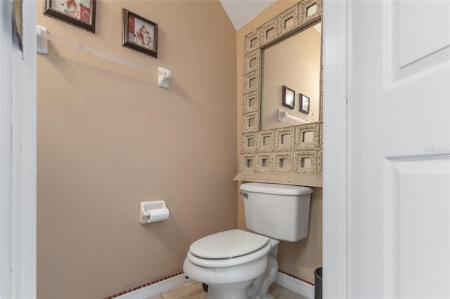 9244 Pecky Cypress Way, Orlando, FL 32836 - bathroom featuring toilet, baseboards, and tile patterned flooring