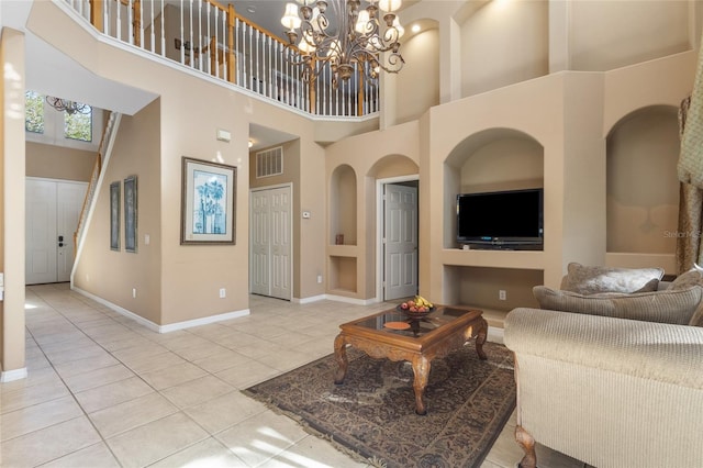 9244 Pecky Cypress Way, Orlando, FL 32836 - living room featuring light tile patterned floors, visible vents, and a towering ceiling