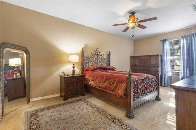 9244 Pecky Cypress Way, Orlando, FL 32836 - bedroom featuring light colored carpet, baseboards, ceiling fan, and visible vents