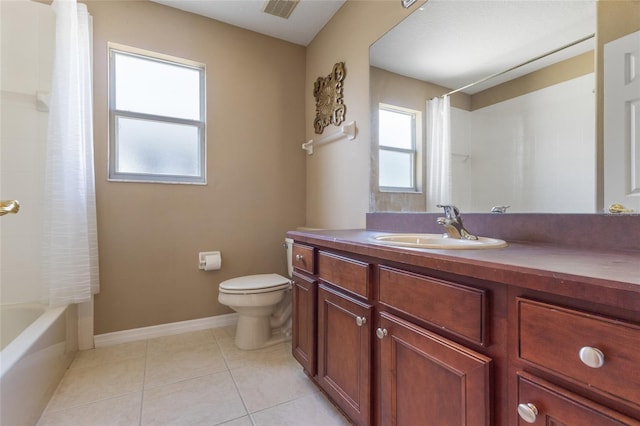 9244 Pecky Cypress Way, Orlando, FL 32836 - full bathroom with visible vents, tile patterned flooring, vanity, toilet, and baseboards