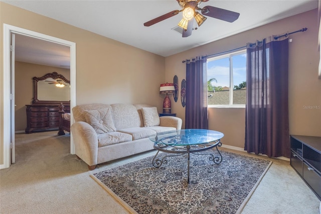 9244 Pecky Cypress Way, Orlando, FL 32836 - living room featuring baseboards, ceiling fan, and light carpet