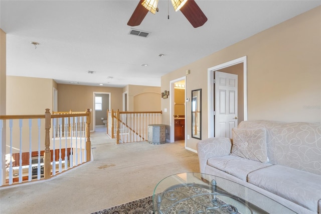 9244 Pecky Cypress Way, Orlando, FL 32836 - carpeted living area with baseboards, ceiling fan, and visible vents