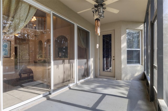 9244 Pecky Cypress Way, Orlando, FL 32836 - view of exterior entry featuring ceiling fan and stucco siding