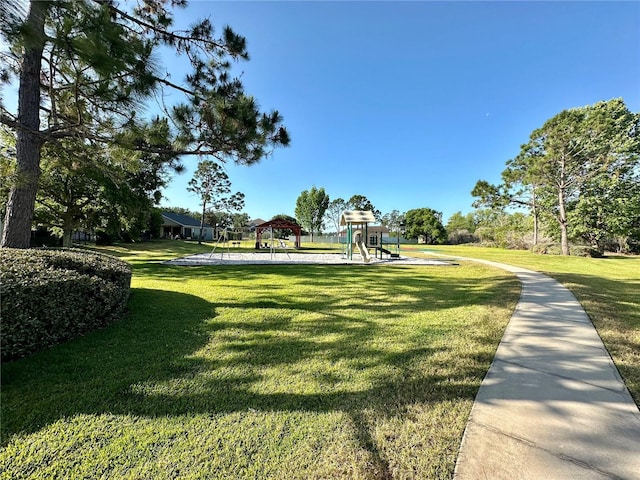 9244 Pecky Cypress Way, Orlando, FL 32836 - view of home's community featuring a lawn and playground community