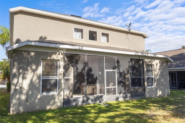 9244 Pecky Cypress Way, Orlando, FL 32836 - back of property featuring a yard, a sunroom, and stucco siding