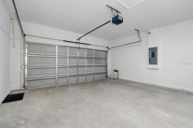 garage with electric panel, concrete block wall, and a garage door opener