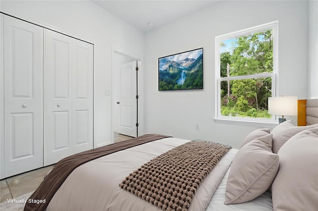 7738 N Creek Way, Citrus Springs, FL 34434 - bedroom with multiple windows, a closet, and light tile patterned flooring
