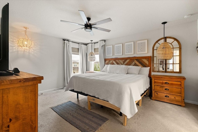 4301 Creek Bank Dr, Kissimmee, FL 34744 - bedroom with light carpet, baseboards, and a ceiling fan