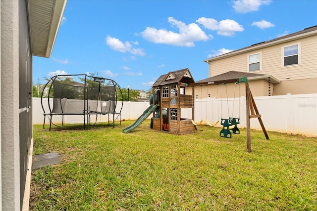 4301 Creek Bank Dr, Kissimmee, FL 34744 - view of playground featuring a trampoline, a fenced backyard, and a lawn
