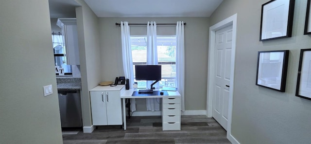 home office with baseboards and dark wood-type flooring