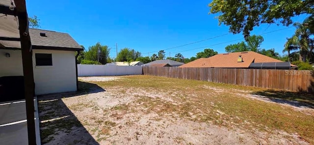 view of yard with a fenced backyard