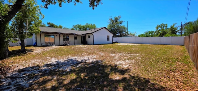 view of yard with a fenced backyard and a patio