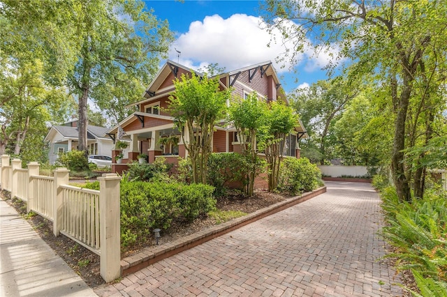 view of side of home with fence