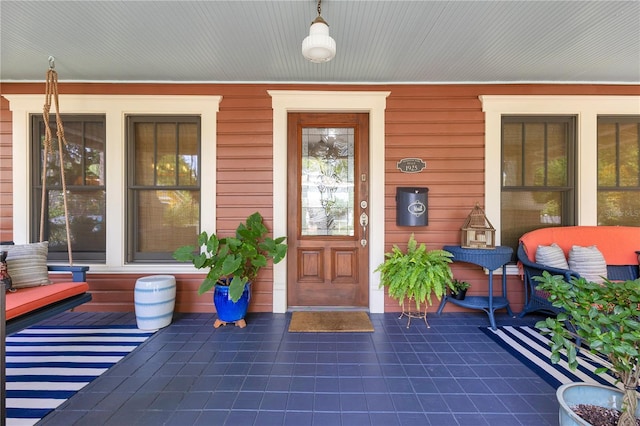 property entrance featuring covered porch