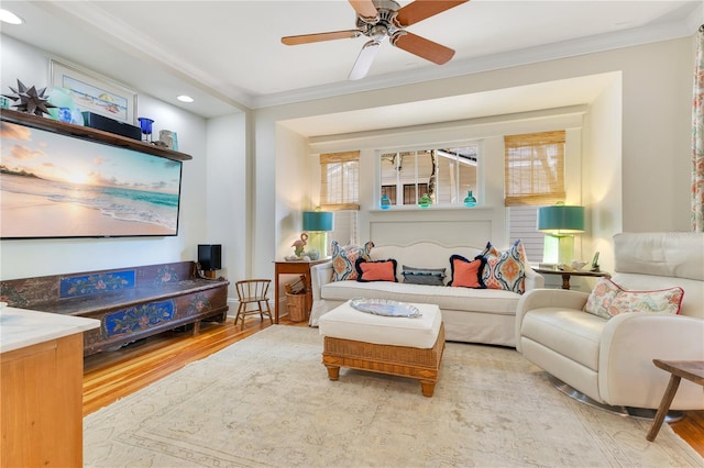 living room with recessed lighting, wood finished floors, ceiling fan, and crown molding