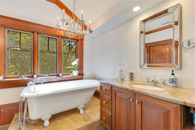 full bathroom featuring lofted ceiling, a soaking tub, plenty of natural light, and a notable chandelier