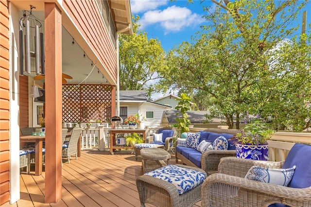 deck with an outdoor hangout area and outdoor dining space