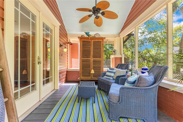 sunroom / solarium with a healthy amount of sunlight and a ceiling fan