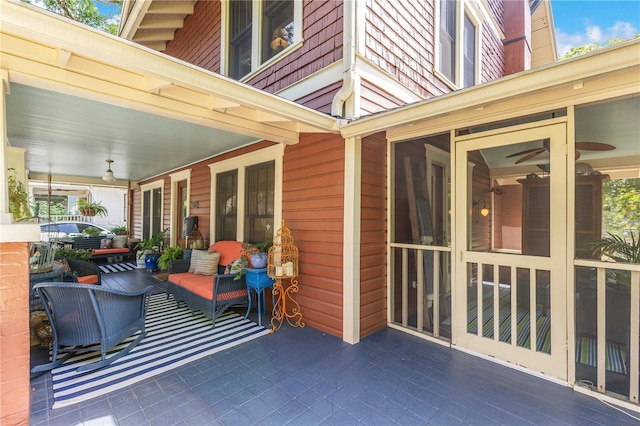 view of patio / terrace with a sunroom
