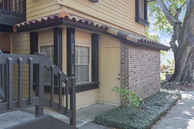 view of side of property with brick siding