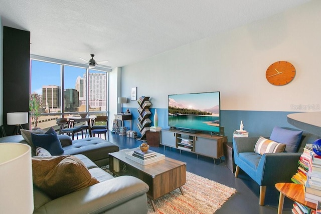 322 E Central Blvd Unit 1008, Orlando, FL 32801 - living room with a wall of windows, concrete flooring, a ceiling fan, and a textured ceiling