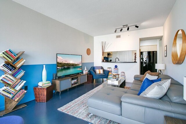 322 E Central Blvd Unit 1008, Orlando, FL 32801 - living room with rail lighting and visible vents