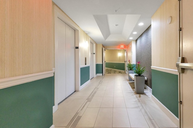 322 E Central Blvd Unit 1008, Orlando, FL 32801 - hall featuring elevator, recessed lighting, baseboards, light tile patterned floors, and a tray ceiling