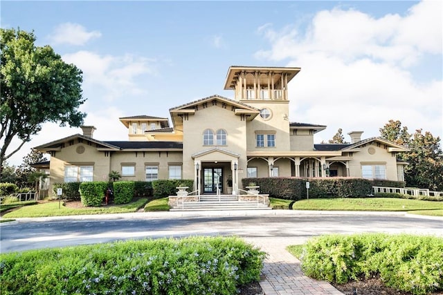 view of front of house featuring french doors and stucco siding